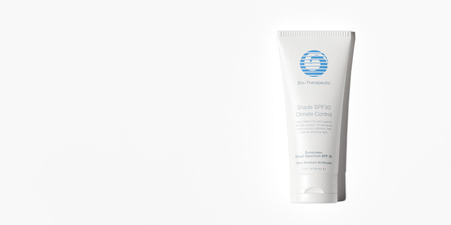 White tube of sunscreen with blue logo on a white background